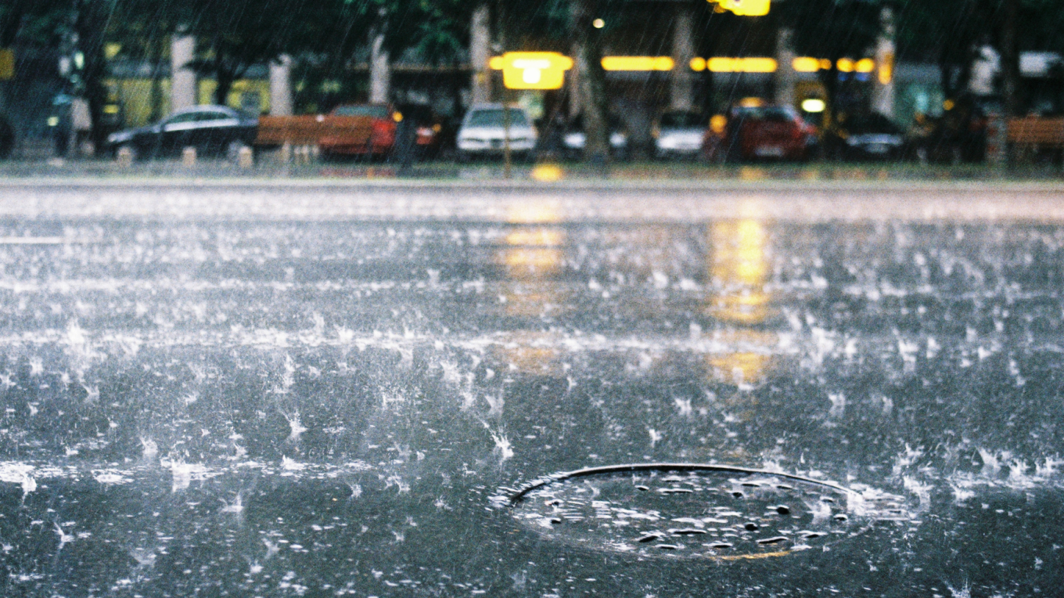 Rain dripping over a road